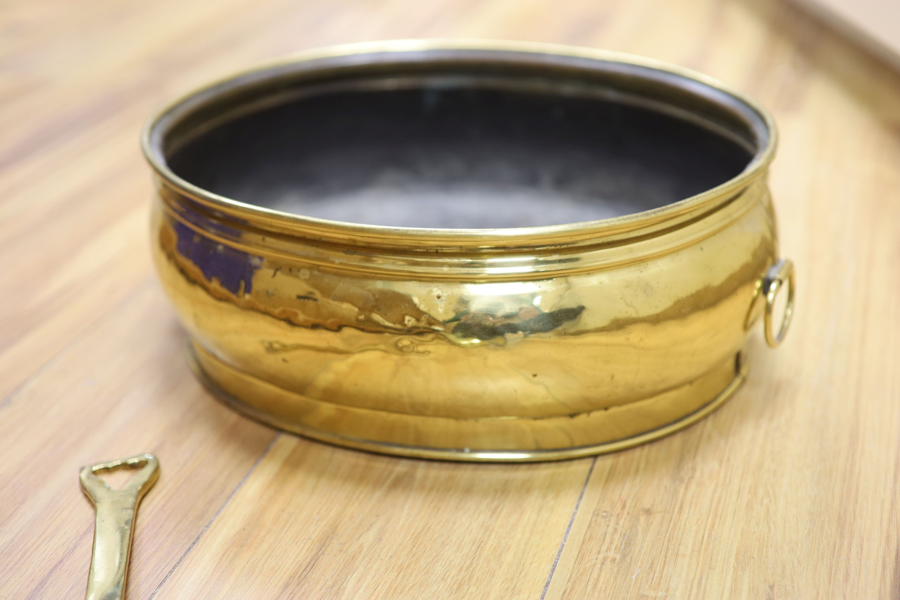 A 19th century oval brass planter and chestnut roaster